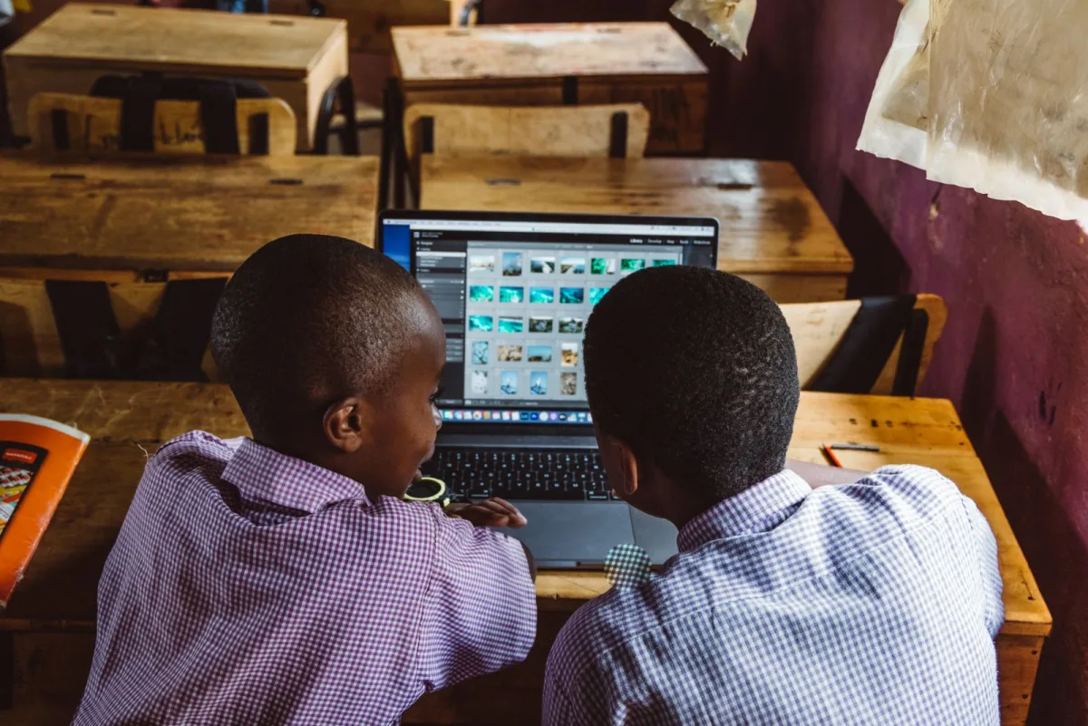 Two learners working together on a laptop
